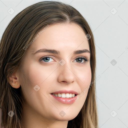 Joyful white young-adult female with long  brown hair and blue eyes