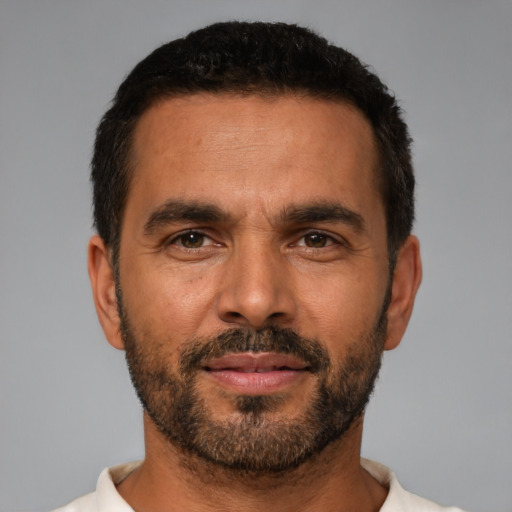 Neutral latino adult male with short  black hair and brown eyes
