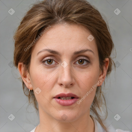 Joyful white adult female with medium  brown hair and grey eyes