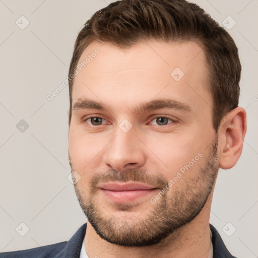 Joyful white young-adult male with short  brown hair and brown eyes