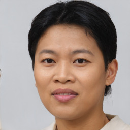 Joyful asian young-adult female with short  black hair and brown eyes