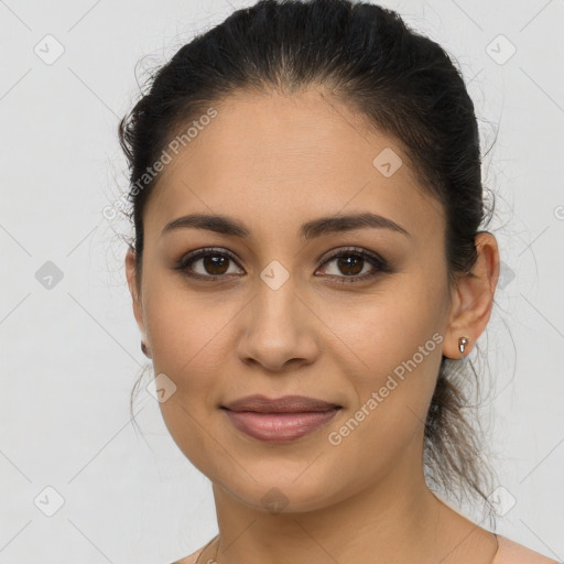 Joyful latino young-adult female with long  brown hair and brown eyes