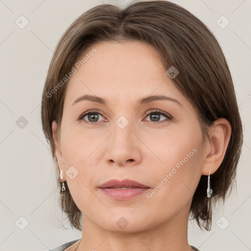 Joyful white adult female with medium  brown hair and grey eyes