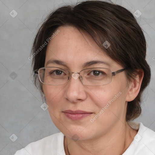 Joyful white adult female with medium  brown hair and brown eyes