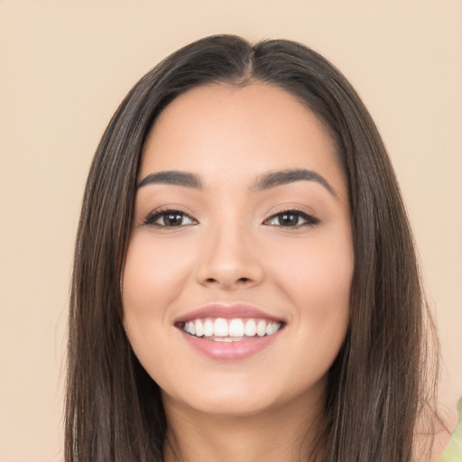 Joyful white young-adult female with long  black hair and brown eyes