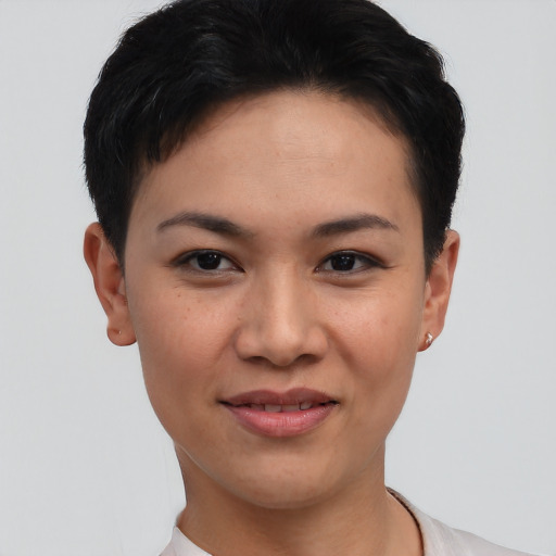 Joyful asian young-adult female with short  black hair and brown eyes