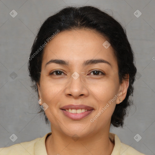 Joyful latino adult female with medium  brown hair and brown eyes