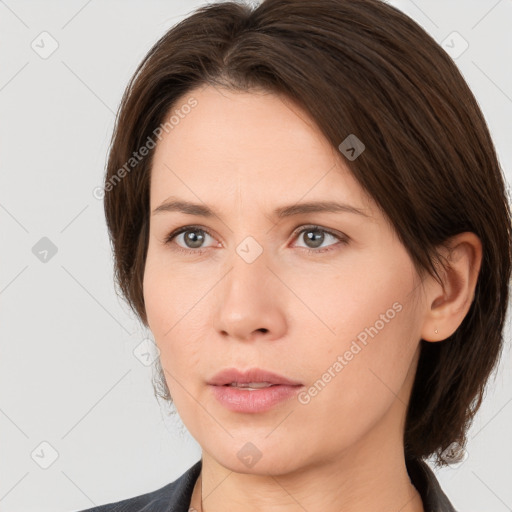 Neutral white young-adult female with medium  brown hair and brown eyes