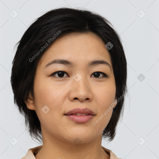 Joyful asian young-adult female with medium  black hair and brown eyes