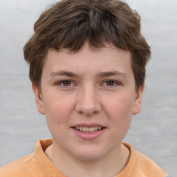 Joyful white child male with short  brown hair and brown eyes