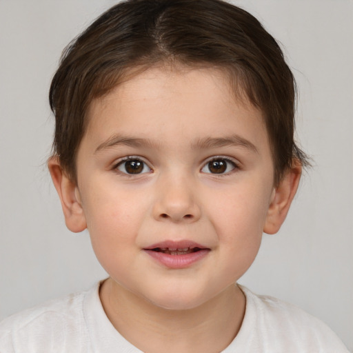 Joyful white child female with short  brown hair and brown eyes