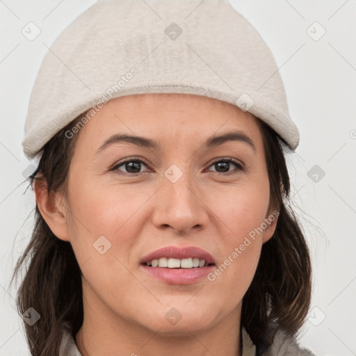 Joyful white young-adult female with medium  brown hair and grey eyes