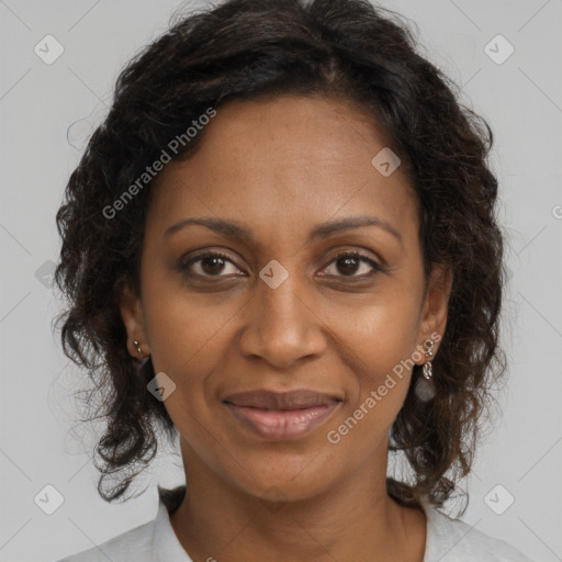 Joyful black adult female with medium  brown hair and brown eyes