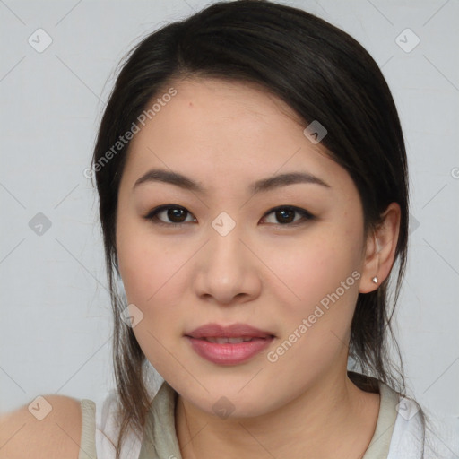 Joyful asian young-adult female with medium  black hair and brown eyes