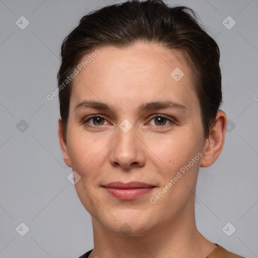 Joyful white young-adult female with short  brown hair and brown eyes