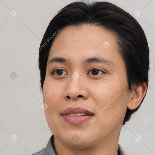 Joyful asian young-adult female with medium  brown hair and brown eyes