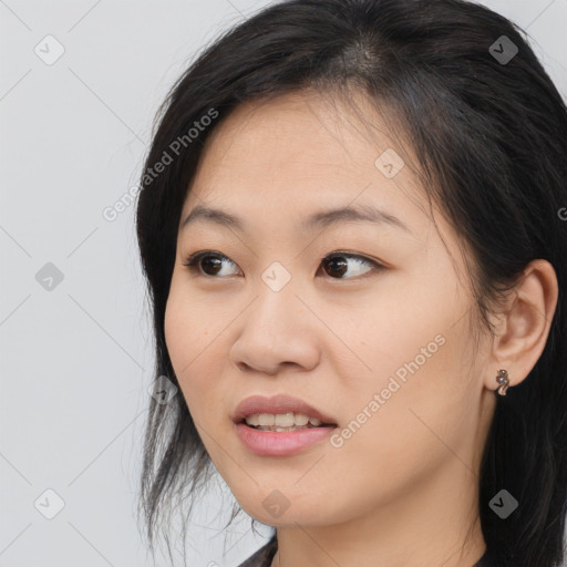 Joyful asian young-adult female with medium  black hair and brown eyes