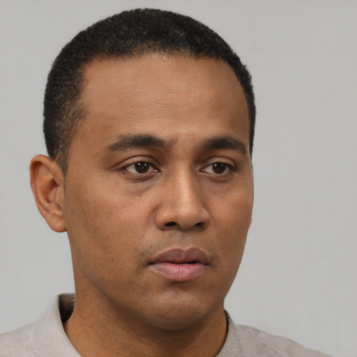 Neutral black young-adult male with short  black hair and brown eyes