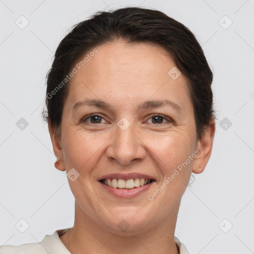 Joyful white adult female with short  brown hair and brown eyes