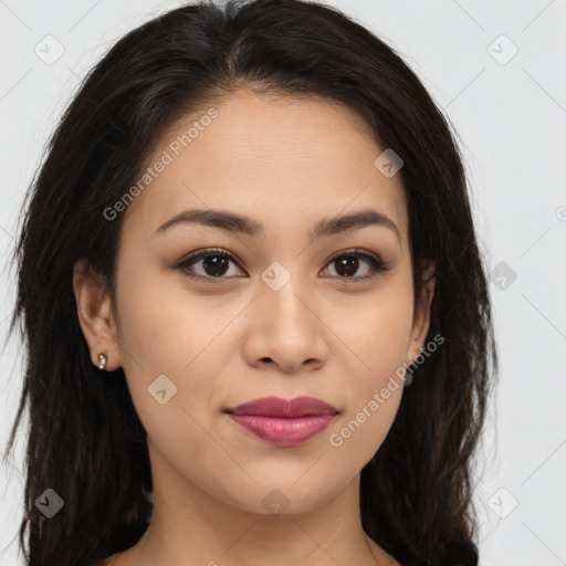 Joyful latino young-adult female with long  brown hair and brown eyes