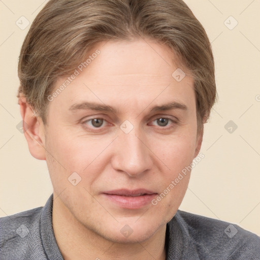 Joyful white adult male with short  brown hair and grey eyes