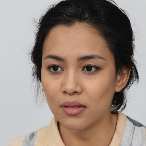 Neutral latino young-adult female with medium  brown hair and brown eyes