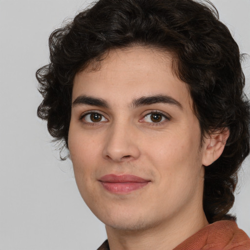 Joyful white young-adult male with medium  brown hair and brown eyes