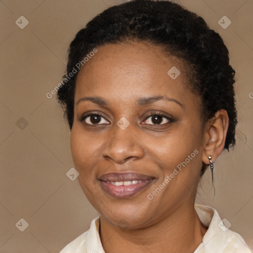 Joyful black adult female with medium  brown hair and brown eyes