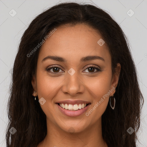 Joyful latino young-adult female with long  brown hair and brown eyes