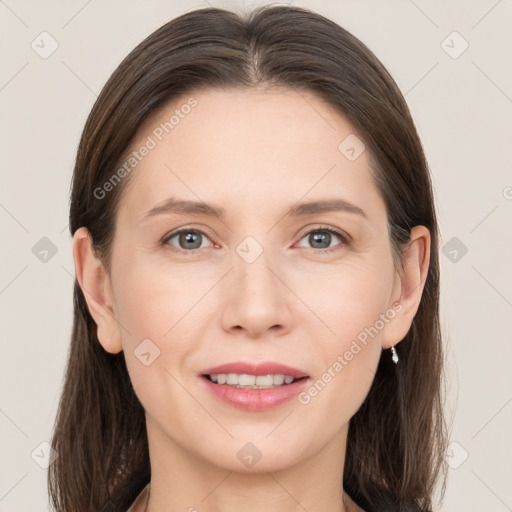 Joyful white young-adult female with long  brown hair and grey eyes