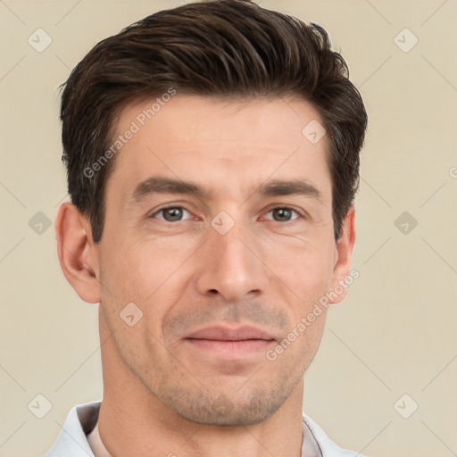 Joyful white adult male with short  brown hair and brown eyes