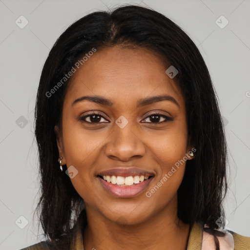 Joyful black young-adult female with long  brown hair and brown eyes