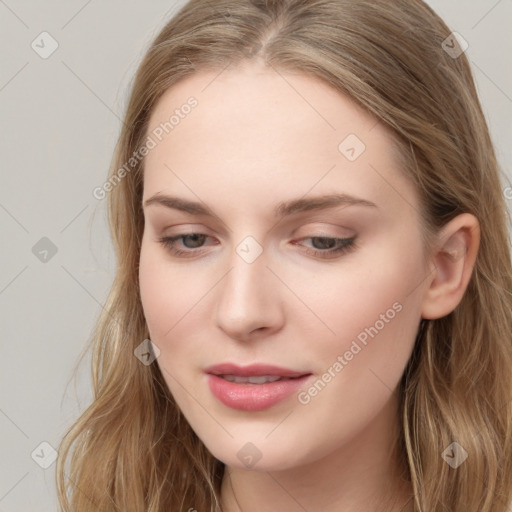 Joyful white young-adult female with long  brown hair and blue eyes