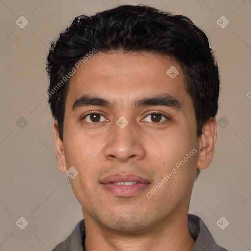 Joyful asian young-adult male with short  black hair and brown eyes
