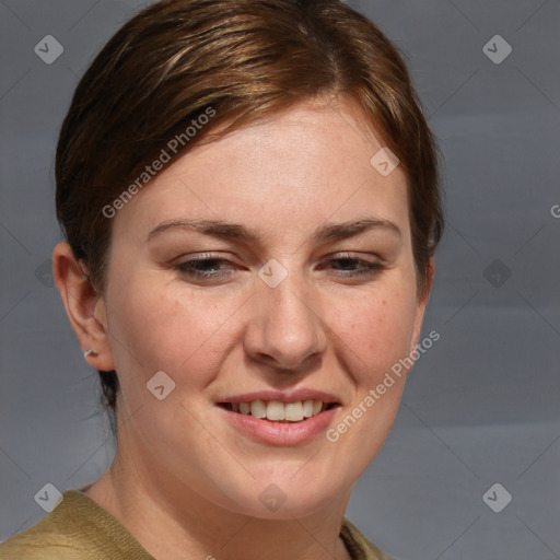 Joyful white adult female with medium  brown hair and blue eyes