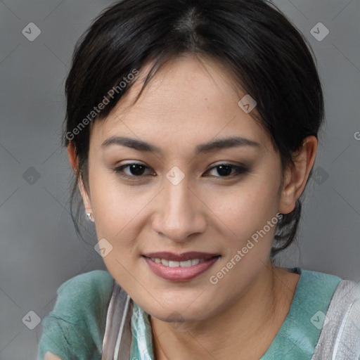 Joyful asian young-adult female with medium  brown hair and brown eyes