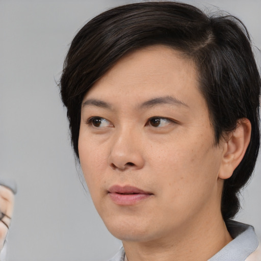 Neutral asian young-adult female with medium  black hair and brown eyes