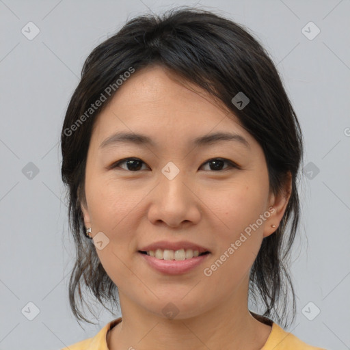 Joyful asian young-adult female with medium  brown hair and brown eyes