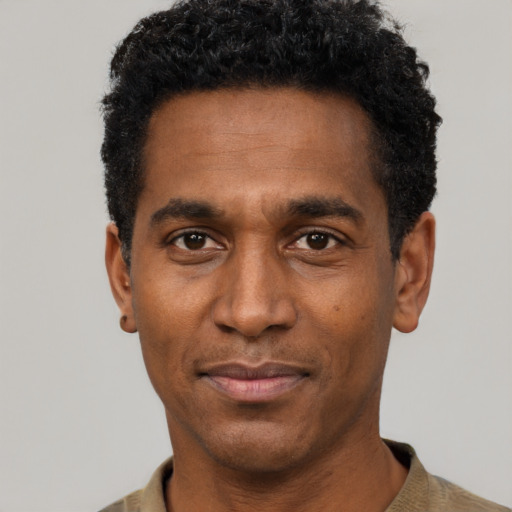 Neutral black adult male with short  black hair and brown eyes