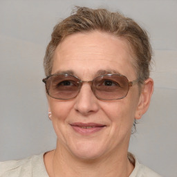 Joyful white middle-aged female with short  brown hair and brown eyes