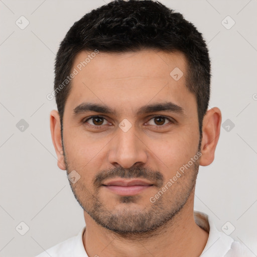 Joyful white young-adult male with short  black hair and brown eyes