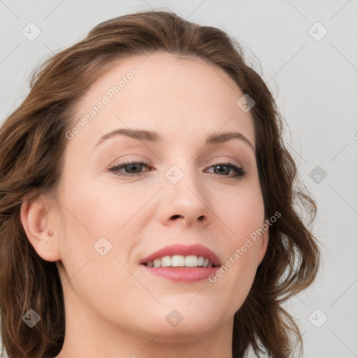 Joyful white young-adult female with long  brown hair and blue eyes