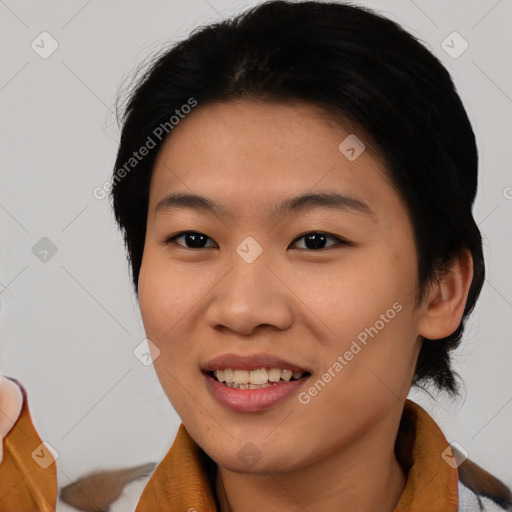 Joyful asian young-adult female with medium  brown hair and brown eyes