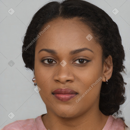 Joyful black young-adult female with long  black hair and brown eyes