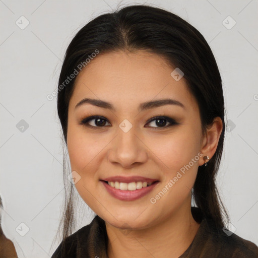 Joyful latino young-adult female with long  brown hair and brown eyes