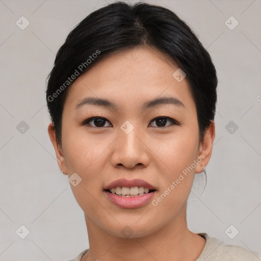 Joyful asian young-adult female with short  black hair and brown eyes