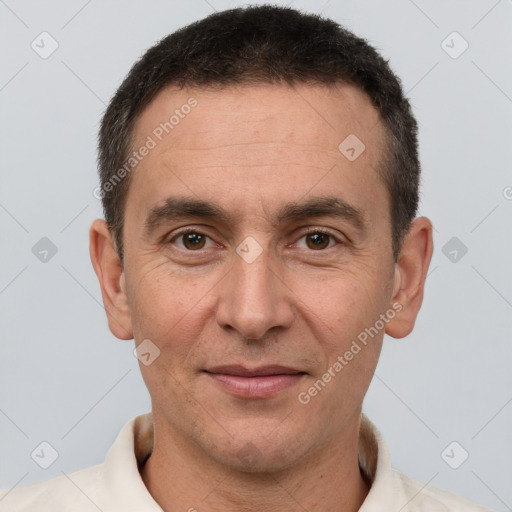 Joyful white adult male with short  brown hair and brown eyes