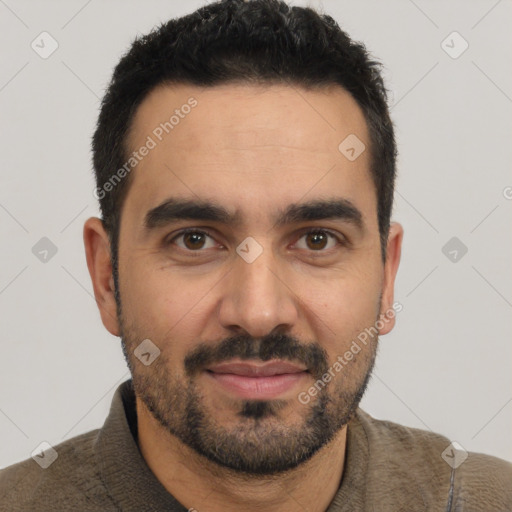 Joyful latino young-adult male with short  black hair and brown eyes