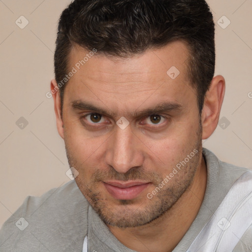 Joyful white adult male with short  brown hair and brown eyes