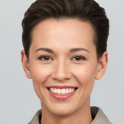 Joyful white young-adult female with short  brown hair and brown eyes